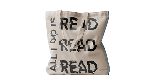 Canvas tote bag with black lettering 'ALL I DO IS READ READ READ'